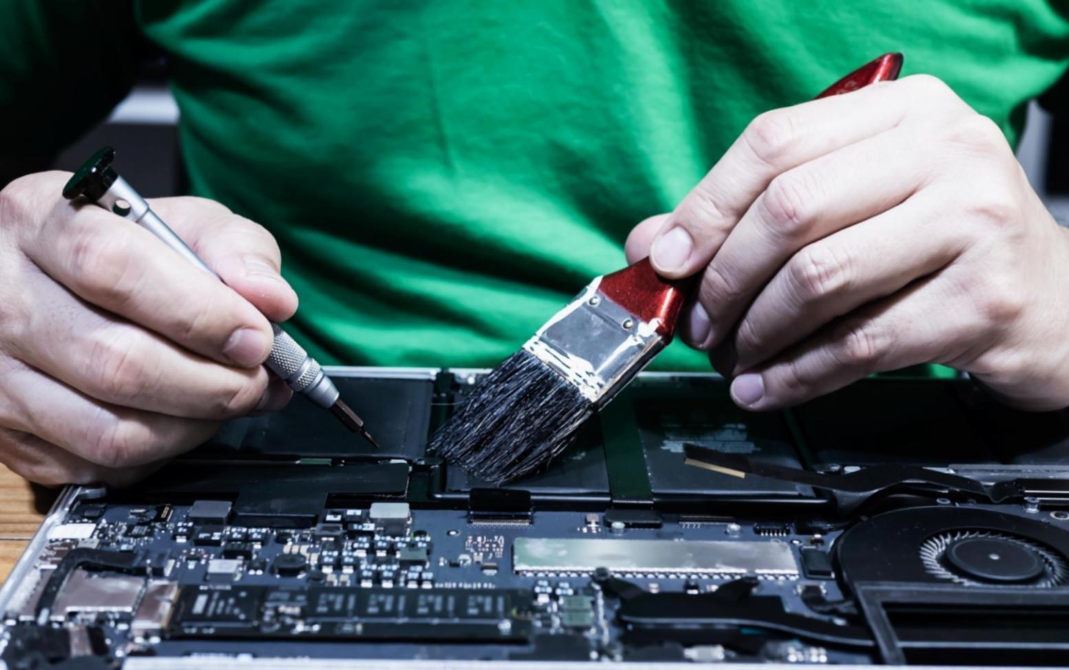 Collaborative workspace showing blockchain developers working together on tokenization projects with laptops and whiteboards